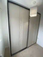 Sahara design wrapped sliding wardrobe in mussel with gun metal frames, fitted in Ingleby Barwick